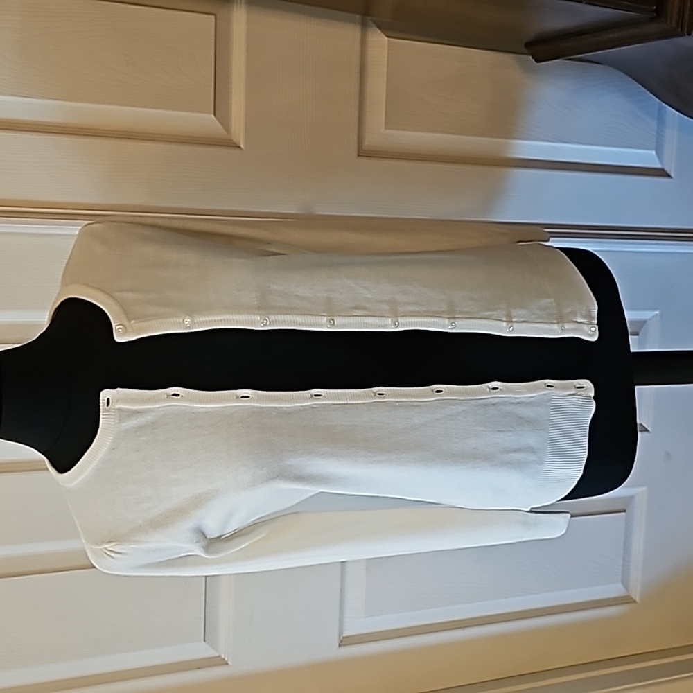 Cream color sweater.